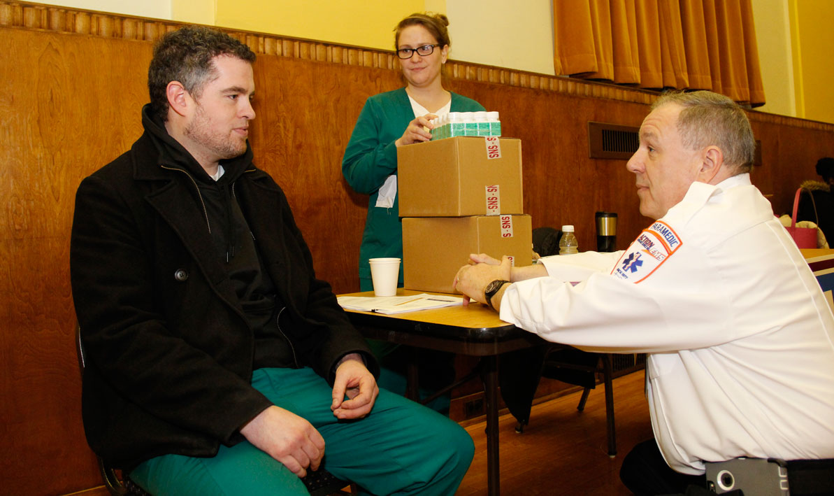 HCC nursing student Will Makowicz of Easthampton plays a patient during an emergency drill at the Holyoke War Memorial last month. He is talking to Holyoke EMT Michael Clapp, as HCC nursing student April Mennard, of Chicopee, looks on.