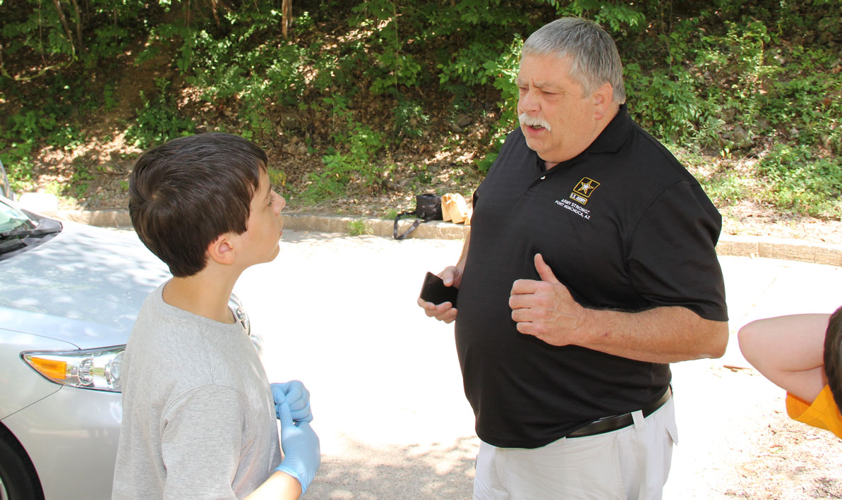 HCC adjunct professor Lou Barry instructs a young student about the basics of crime scene investigation during a Criminal Justice Academy Summer Youth program. 