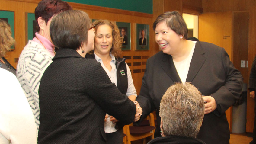 Christina Royal shakes hands with faculty and staff during a meet and greet reception on her first day of work at HCC.