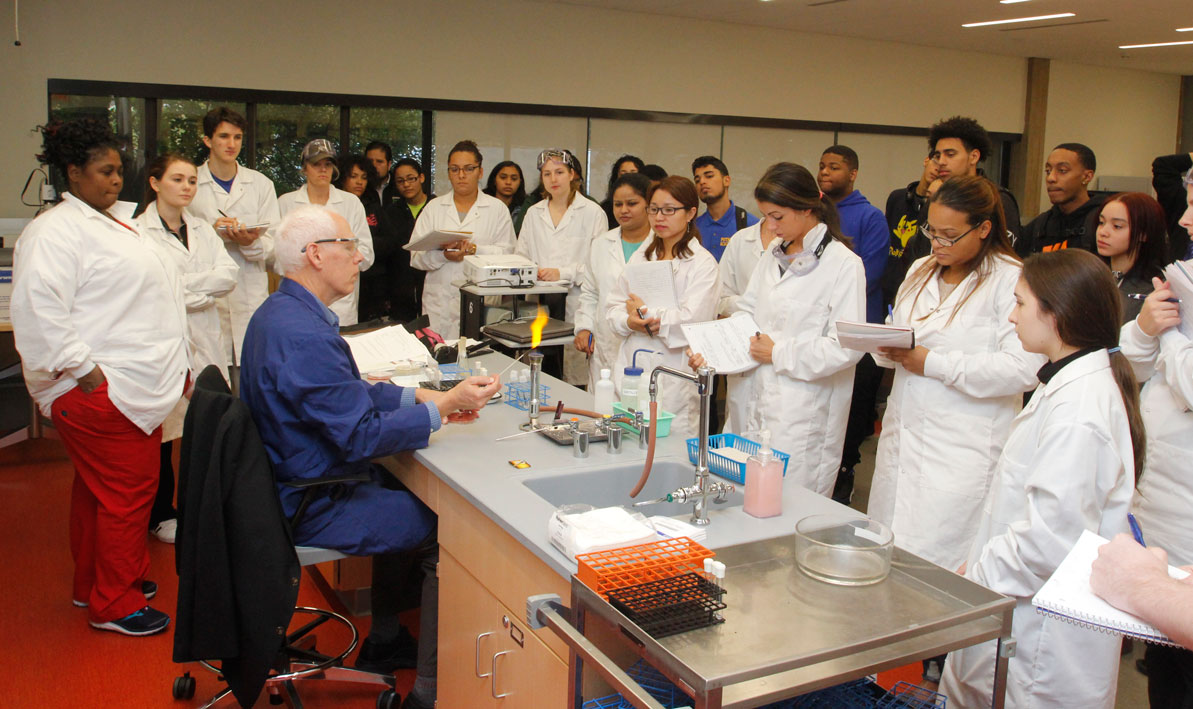 Biology professor James Knapp gives a microbiology demonstration during the grand opening celebration of the new HCC Center for Life Sciences. 