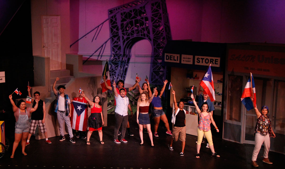 In the Heights dance scene with Puerto Rican flags