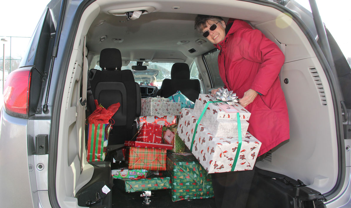 Carlottta Thackeray from the MSPCC loads up her van with gifts from HCC. 