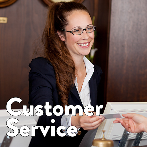 A customer service representative stands at a desk smiling. Text reads Customer Service.