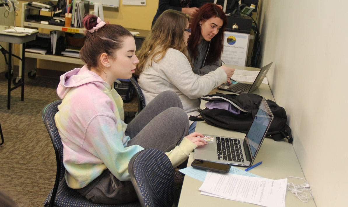Chloe Roux and other Mount Tom Academy students work on their assignments.