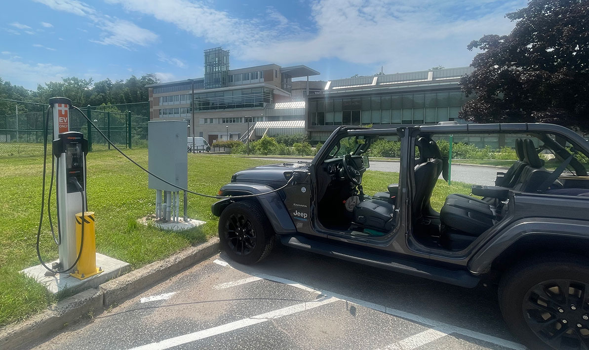 A jeep charges up at an EV station on the HCC campus