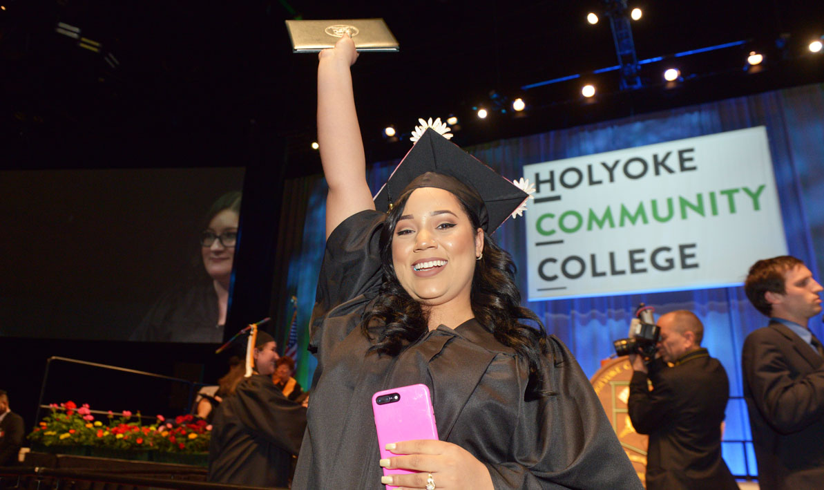 A graduating HCC student celebrates after receiving her diploma at Commencement 2017.