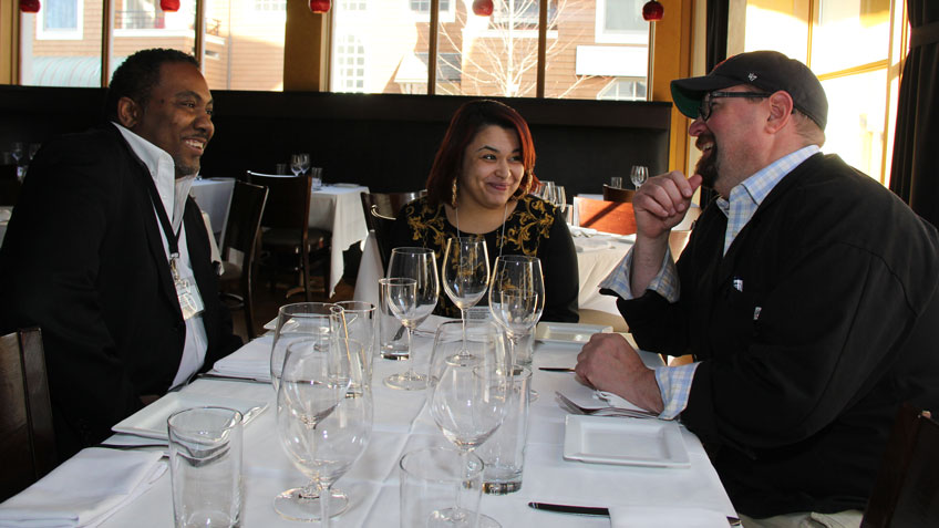 Chef Alan Anischik, right, talks to Johnny Scott, left, and Noelia Burgos, middle, both of Springfield.