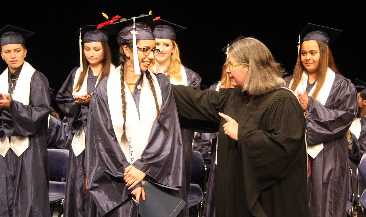 HCC Gateway to College coordinator Vivian Ostrowski, right, talks to new graduate Melanie Acevedo, of Springfield, in June.