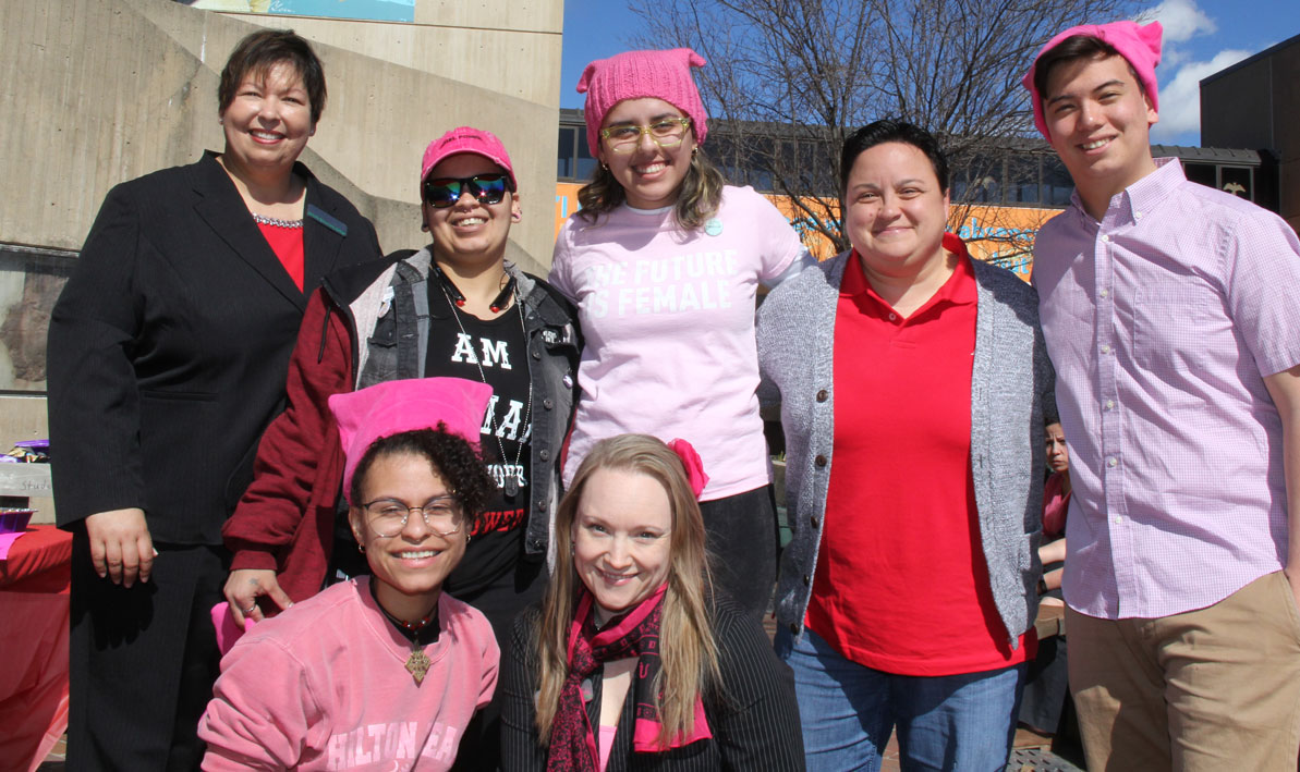 HCC president Christina Royal, back left, shares a moment with students at staff after the rally. 