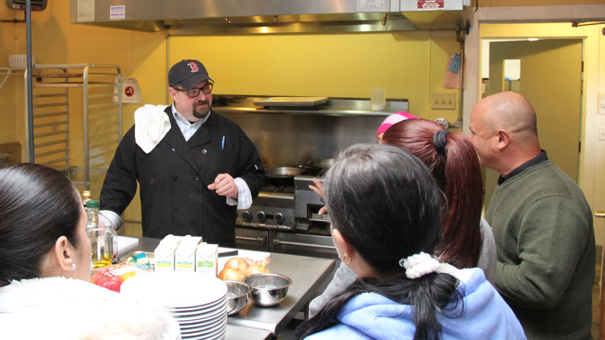 Chef Alan Anischik teaches a cooking session at Nuestras Raices. 