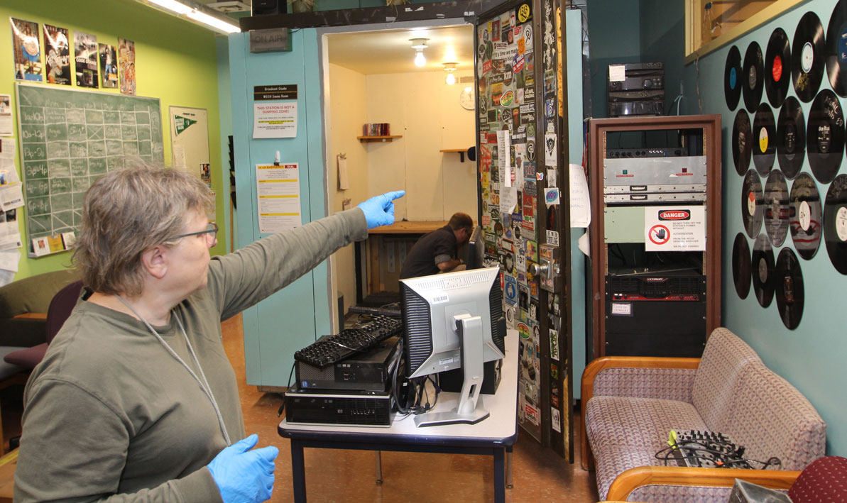 WCCH radio advisor Stevie Converse points to some old equipment they keep around as collector's items. 