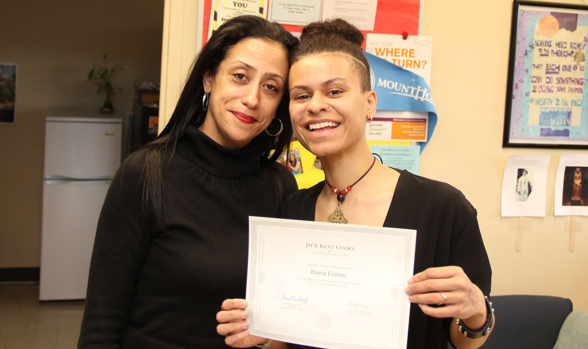 Kiana Estime holds a certificate of recognition from the Jack Kent Cooke Foundation while her adviser Irma Medina stands proudly by.