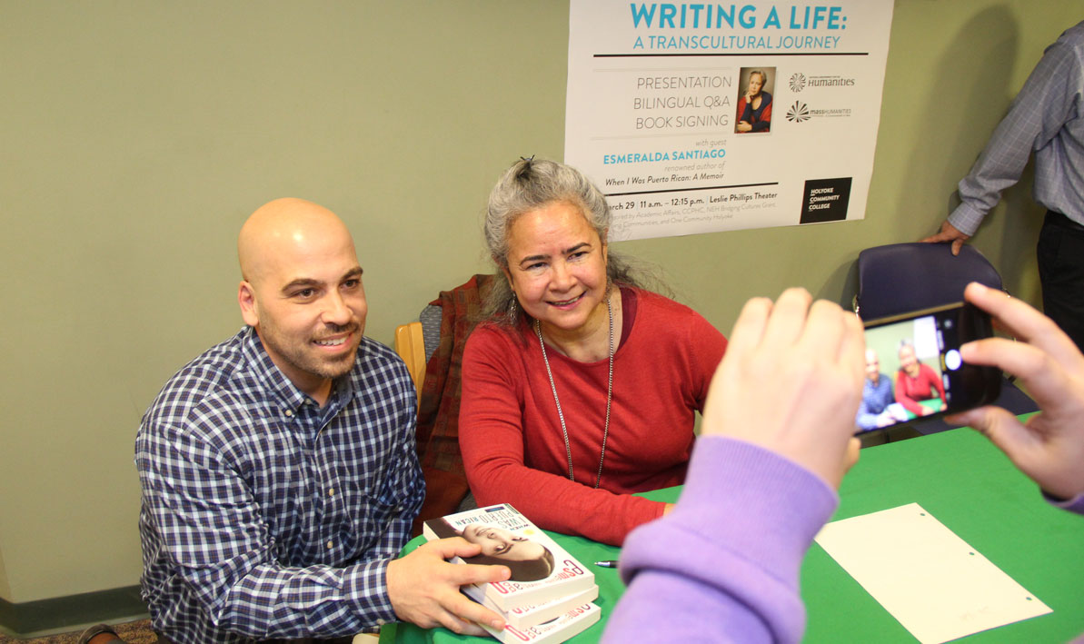 Esmeralda Santiago takes a moment to pose for a photo with HCC criminal justice professor Jose Bou.