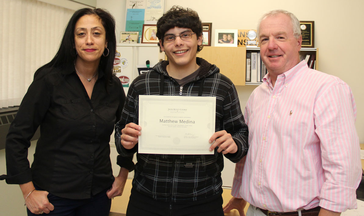 HCC student Matt Medina holds a certificate recognizing him as a Jack Kent Cooke scholarship recipient, with Pathways program coordinator Irma Medina and Transfer Affairs coordinator Mark Broadbent.