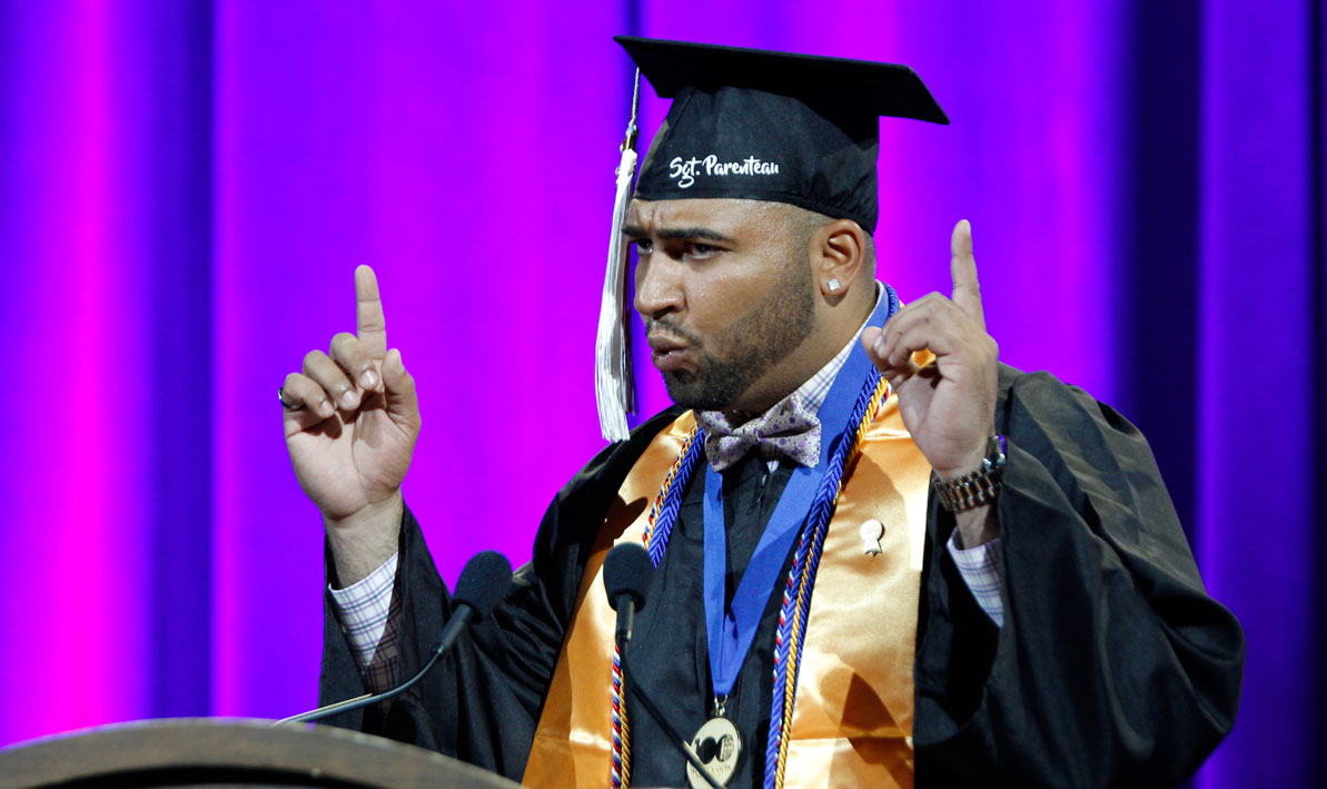 Nicholas Parenteau gives a spoken word performance at Commencement 2018.