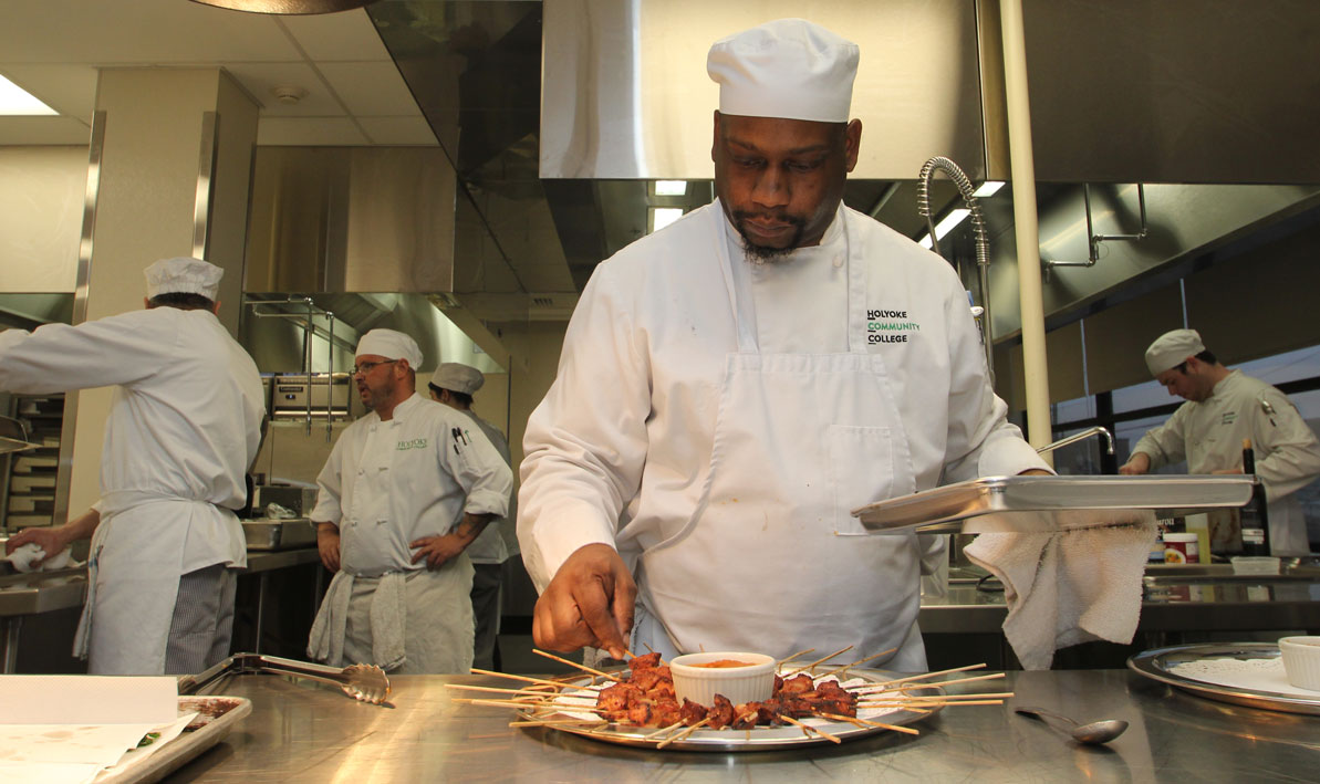 Culinary Arts student Carl King prepares dinner. 