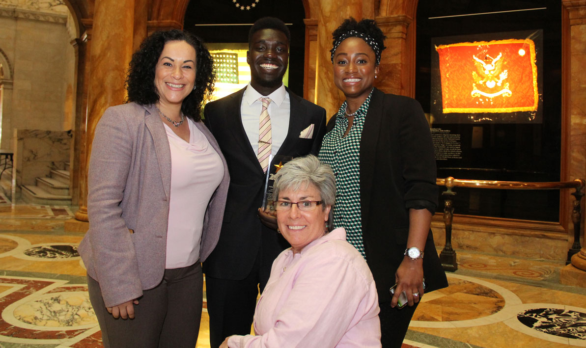 Adam Abdelrahman with staff from HCC's STRIVE program, including his mentor, HCC learning specialist Denise Roy, front. 