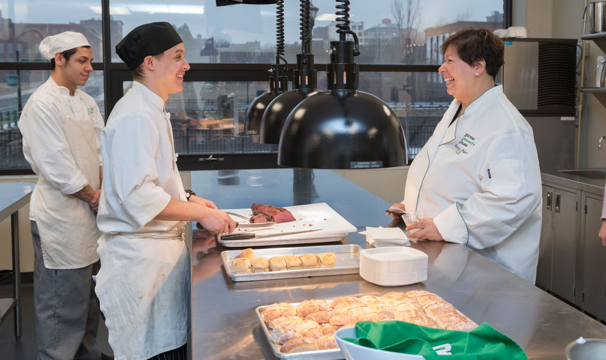 President Royal talks to students during an open house at the HCC MGM Culinary Arts Institute.