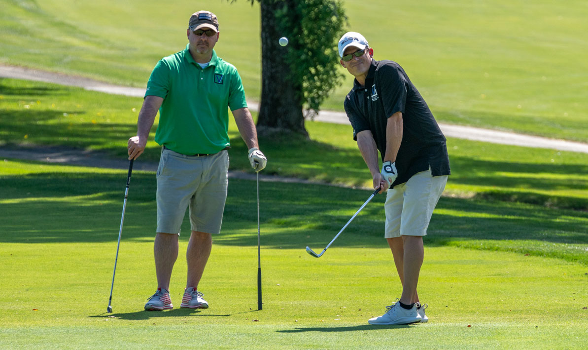 A golfer lofts a pitch onto the green at the 34th annual HCC Foundation Golf Classic Sept. 13 at Springfield Country Club.