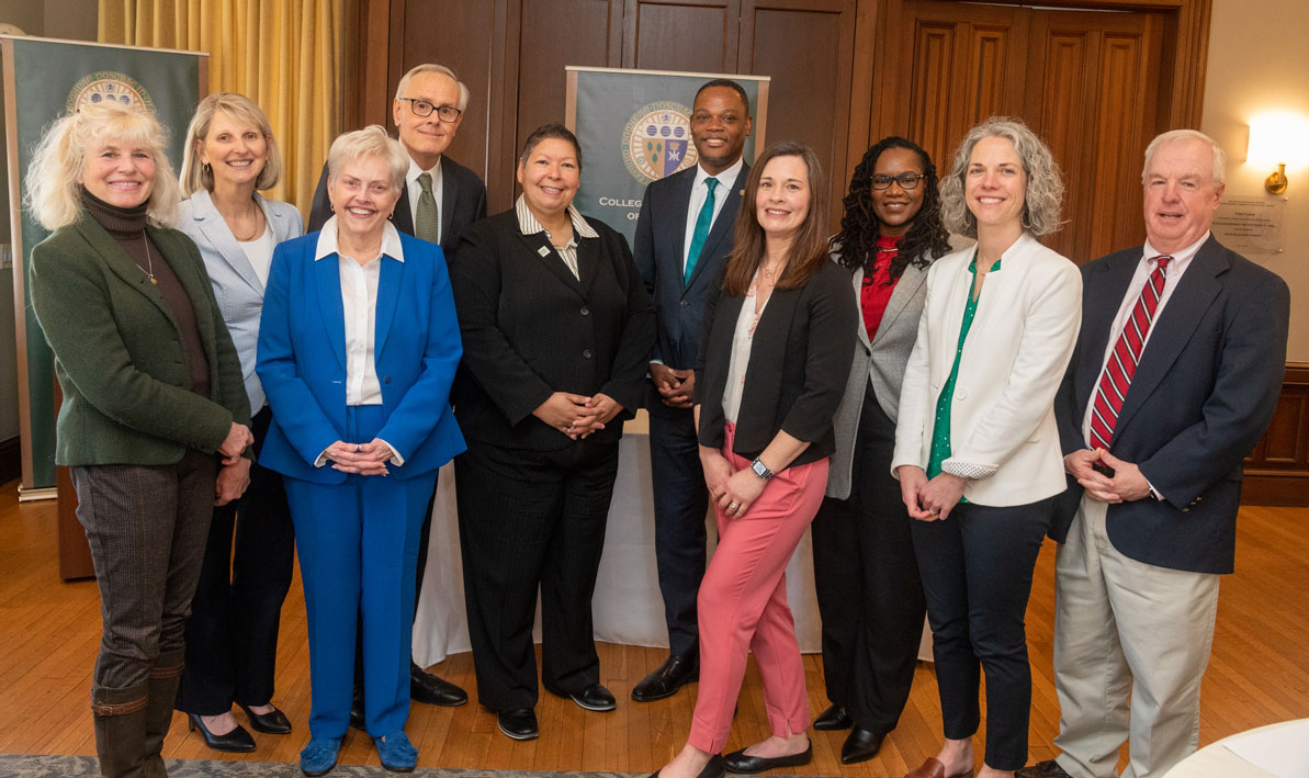 Staff and faculty from Elms and HCC pause after signing a transfer agreement 