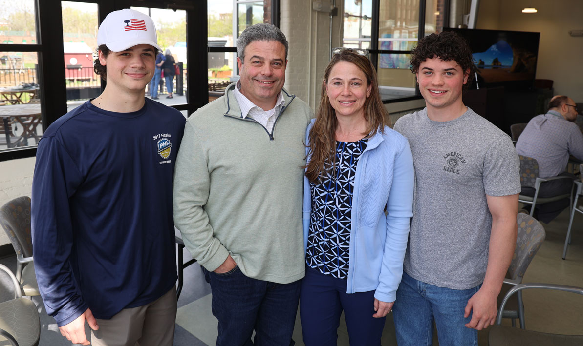 Program graduate Crystal Kenyon, second from right, with her family, son Wyatt, husband Scott, and son Owen, far right. Kenyon is already working as an assistant in the case management department at Baystate Wing Hospital in Palmer. 