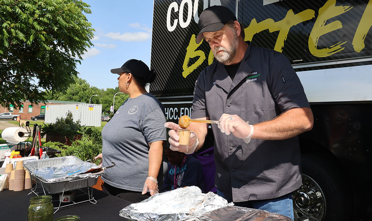 HCC culinary arts student Don Eggleston doles out a sample during the HCC Culinary Club's first Chili Cook-off fundraiser..