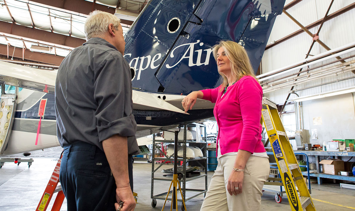 Linda Markham, '83, in the hangar at Cape Air. 