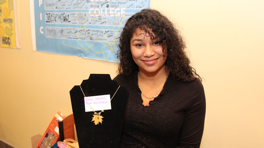 Jaritza Rosario displaying one of her necklaces