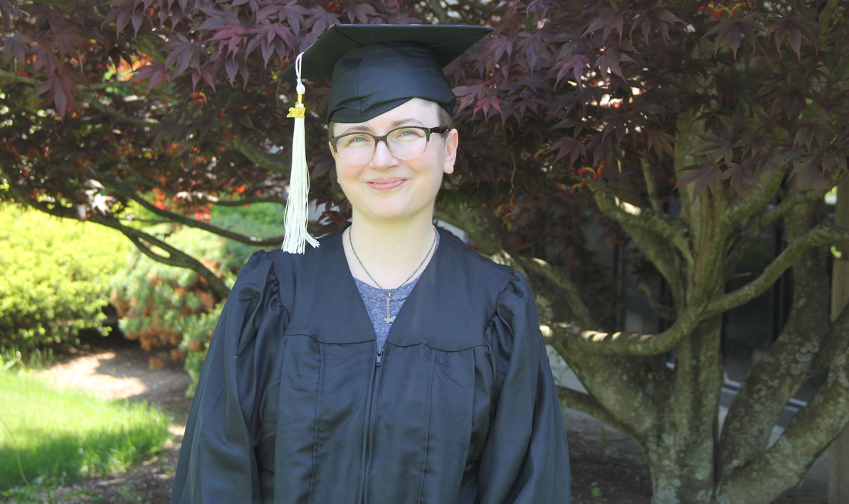 Margaret Schwartz '21 tries on her cap and gown in advance of HCC Commencement on June 5, 2021. 