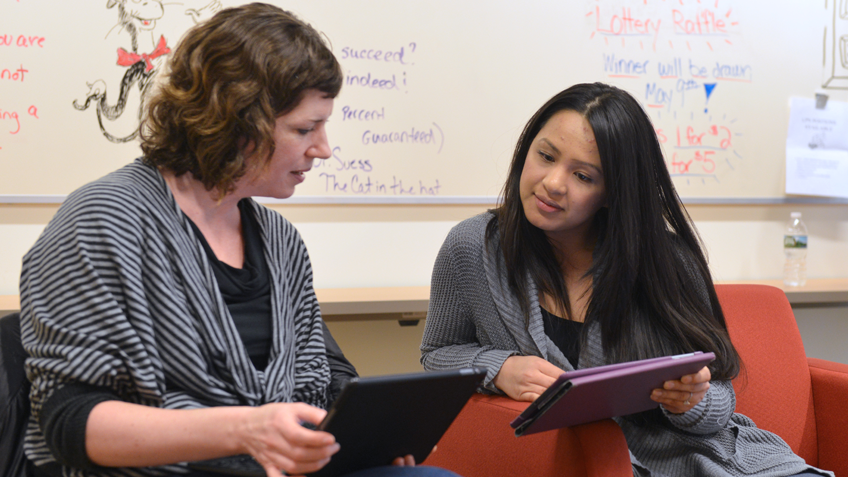 Two female nursing students using tablets together