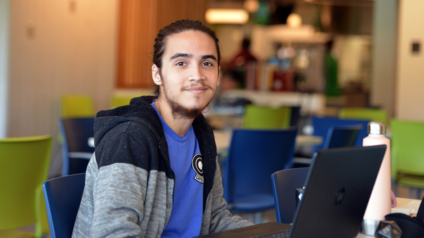 A student uses a laptop