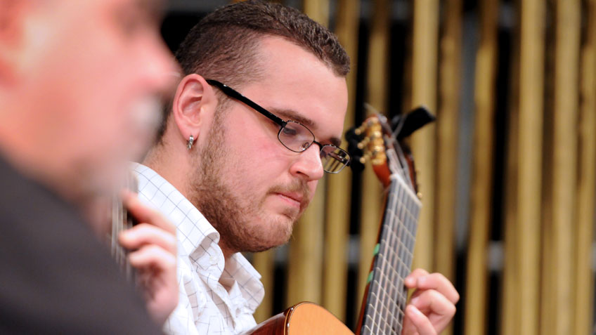 Student playing guitar