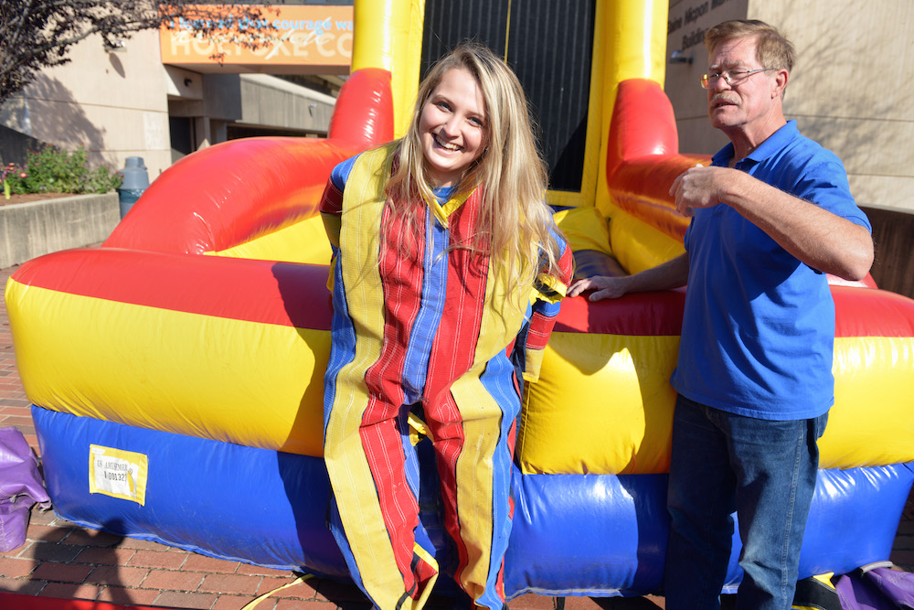 A female student wearing a velcro suit 