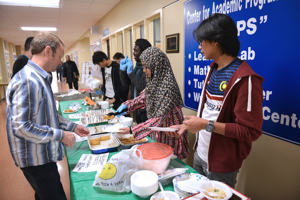 The International Club serving food